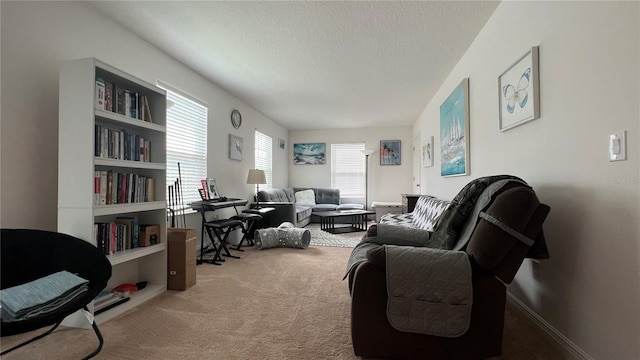 carpeted office space featuring built in shelves