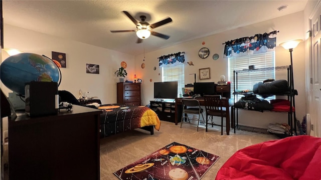 carpeted living room with ceiling fan