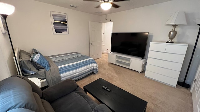 carpeted bedroom featuring ceiling fan