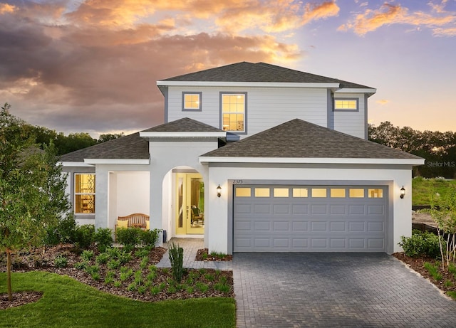 view of front of property with a lawn and a garage