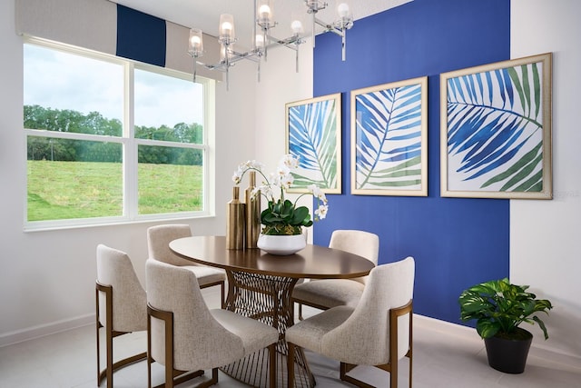 dining space featuring an inviting chandelier and light tile flooring