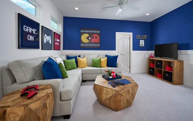 living room featuring light carpet and ceiling fan