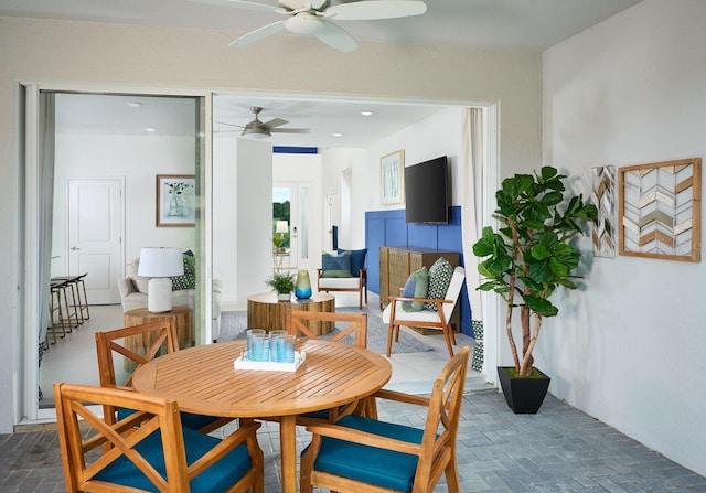 dining room featuring ceiling fan