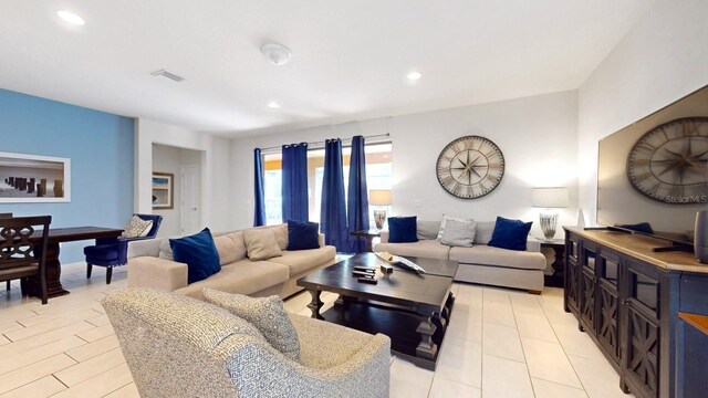 living room featuring light tile floors