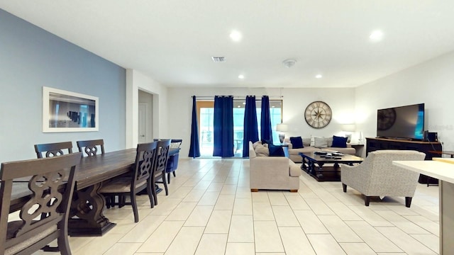 living room featuring light tile floors