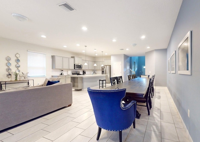 dining area with light tile flooring