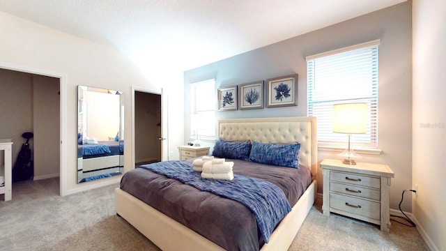 bedroom with light colored carpet