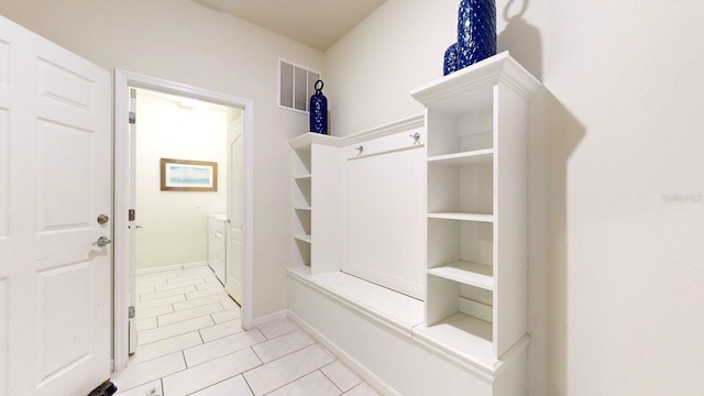 mudroom with light tile floors