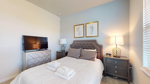 bedroom with light colored carpet