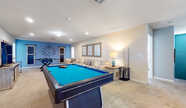 recreation room with light carpet, a textured ceiling, and billiards