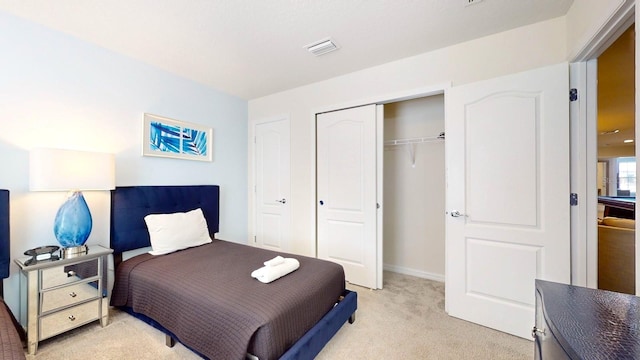 carpeted bedroom with a closet