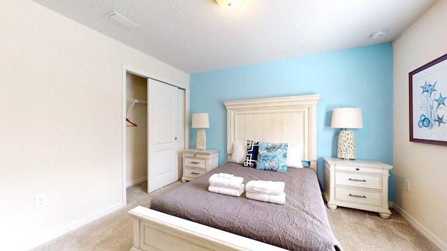 bedroom with light colored carpet and a closet