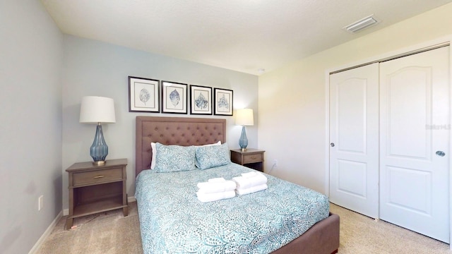 carpeted bedroom featuring a closet