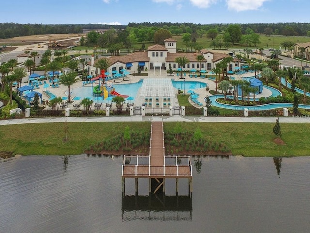 birds eye view of property with a water view