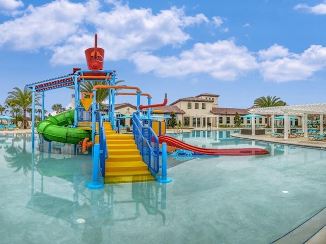 view of play area featuring a community pool