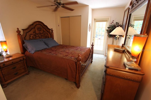 bedroom featuring a closet, ceiling fan, and carpet