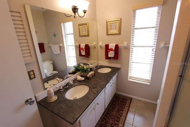 bathroom featuring double sink, tile flooring, and large vanity