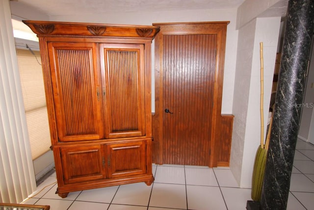 interior details featuring light tile flooring