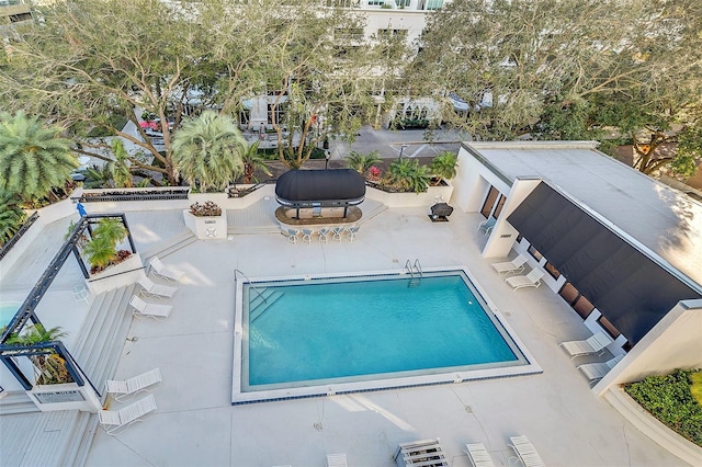 view of pool featuring a patio