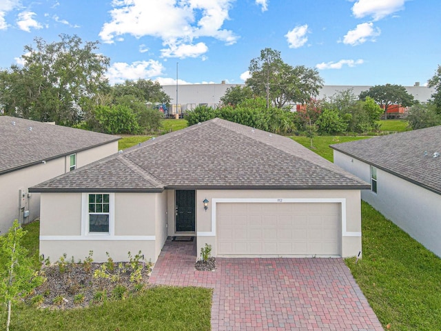 view of front of property with a garage