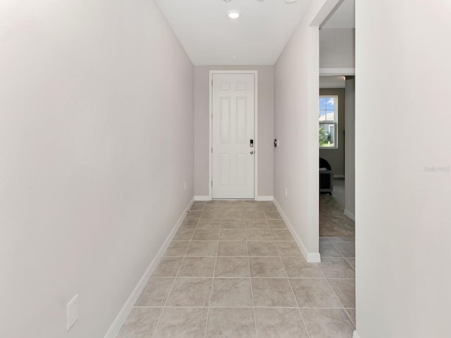 hall with light tile floors