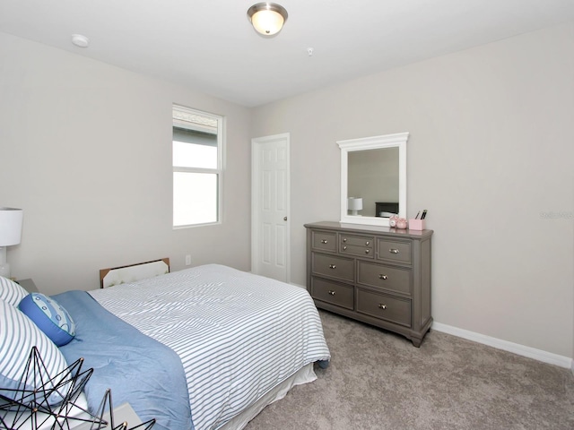 bedroom with light colored carpet