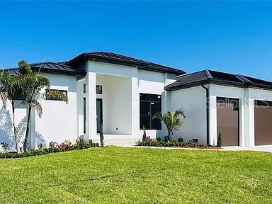 rear view of house with a yard