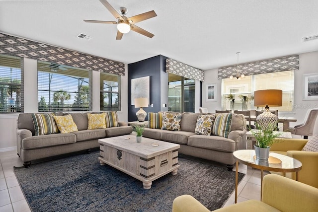 living room with tile patterned floors and ceiling fan