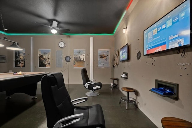 interior space with concrete floors, billiards, and ceiling fan