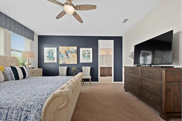 carpeted bedroom with connected bathroom and ceiling fan