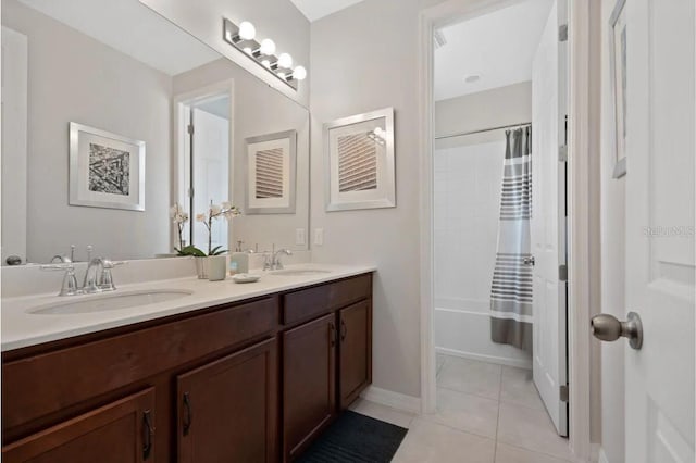 bathroom with tile patterned floors, shower / tub combo, and dual bowl vanity