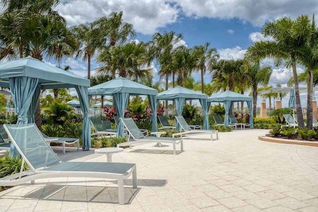 view of property's community with a gazebo and a patio area