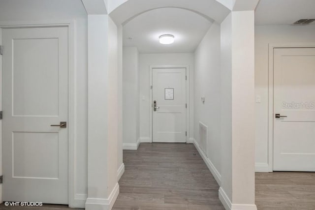 corridor featuring light hardwood / wood-style flooring