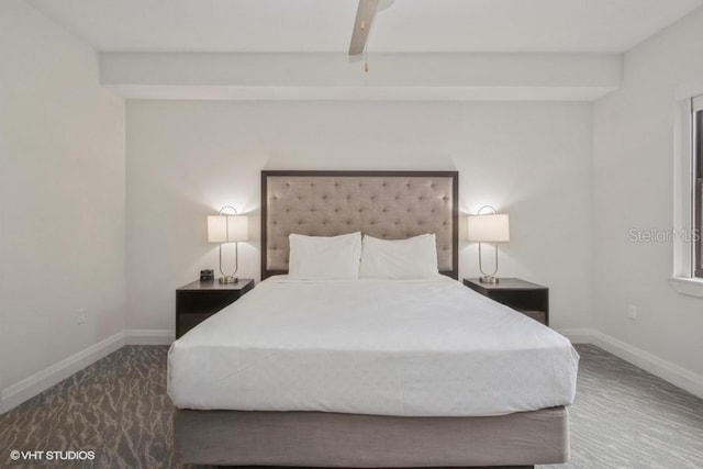 bedroom featuring ceiling fan and beamed ceiling