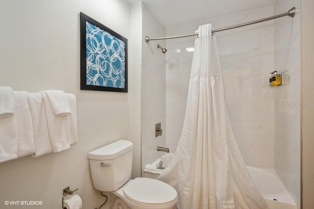 bathroom with toilet and shower / bathtub combination with curtain