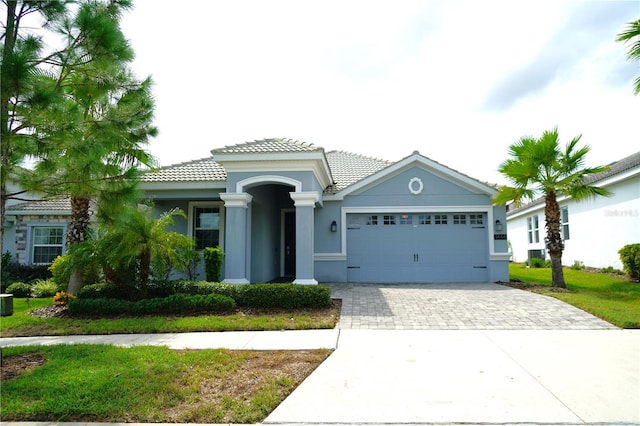 view of front of home with a garage