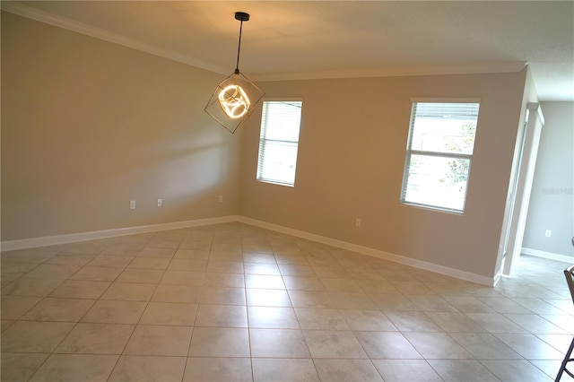 unfurnished room featuring crown molding and light tile flooring