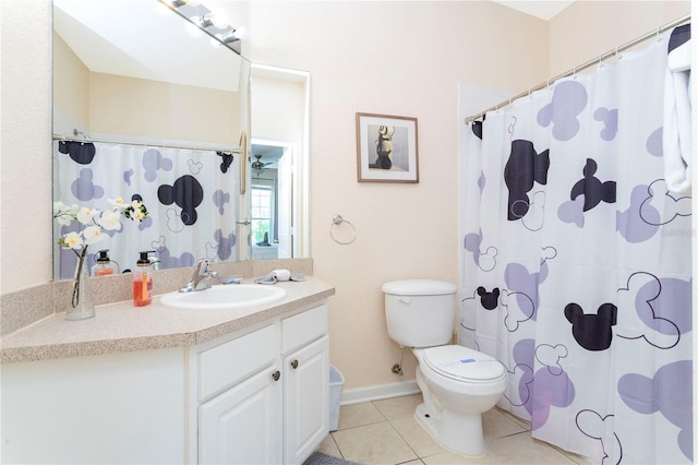 bathroom featuring tile floors, oversized vanity, and toilet