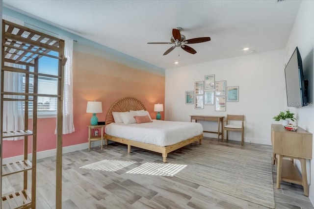 bedroom featuring ceiling fan and light wood-type flooring