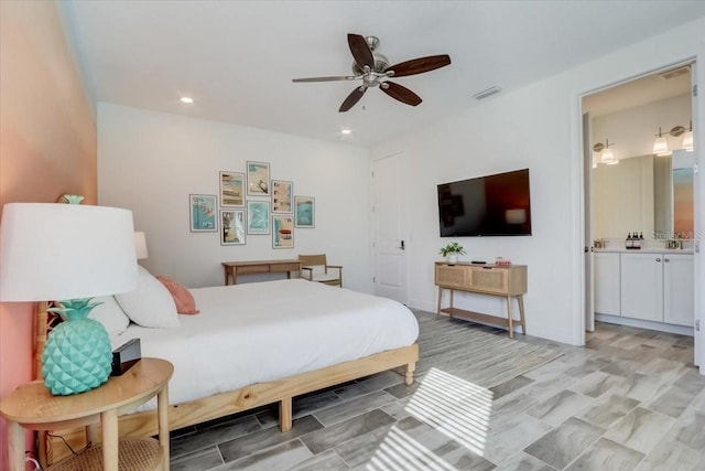 bedroom with ensuite bath and ceiling fan