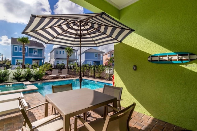 view of swimming pool with a patio area