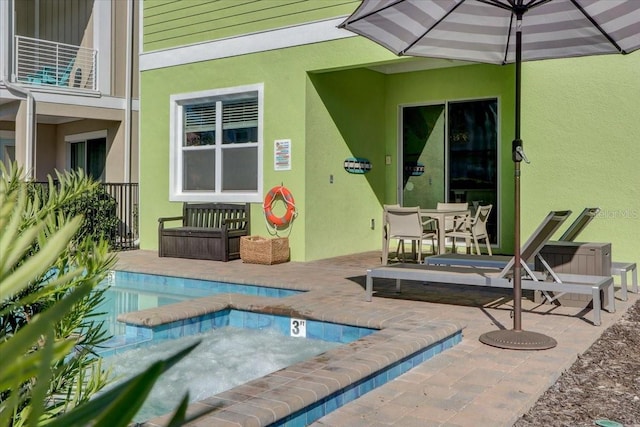 view of swimming pool featuring a patio area