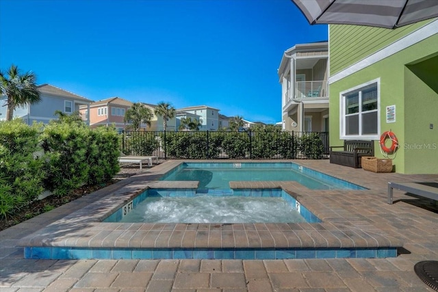 view of swimming pool with a patio