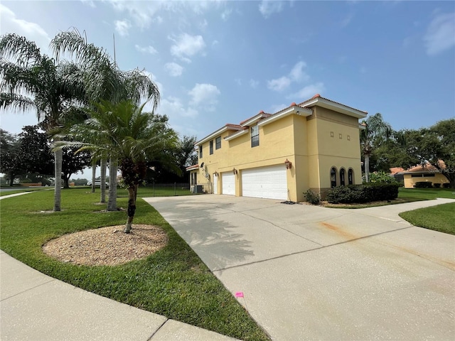 mediterranean / spanish-style house with a front lawn