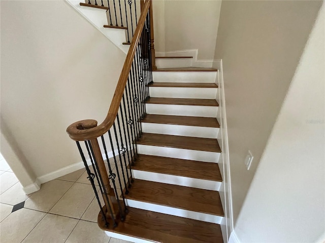 stairs with light tile floors