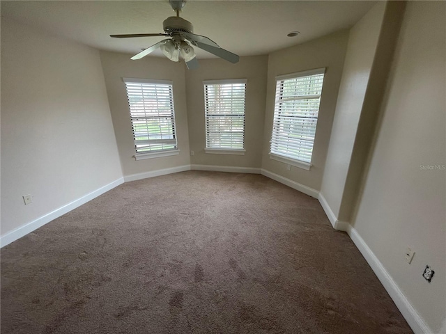 carpeted empty room with ceiling fan