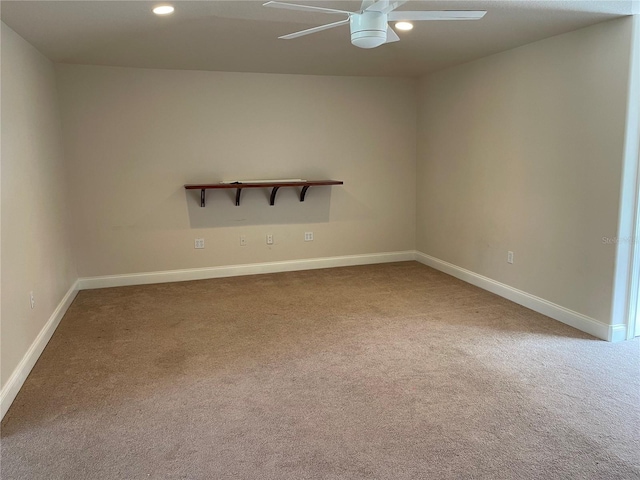 empty room with light carpet and ceiling fan