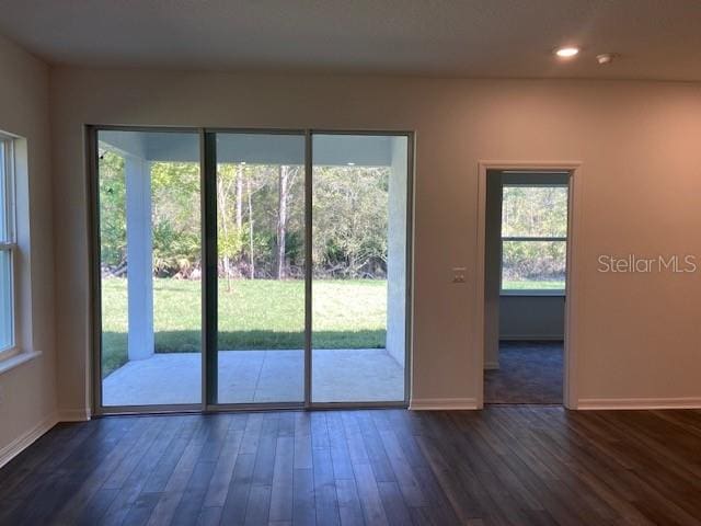 doorway featuring dark hardwood / wood-style floors