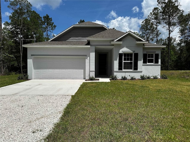 view of front of house with a garage and a front yard