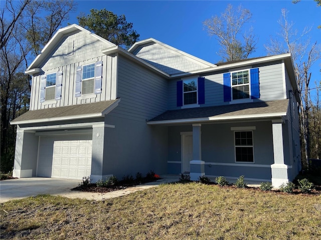 view of front facade with a garage and a front lawn